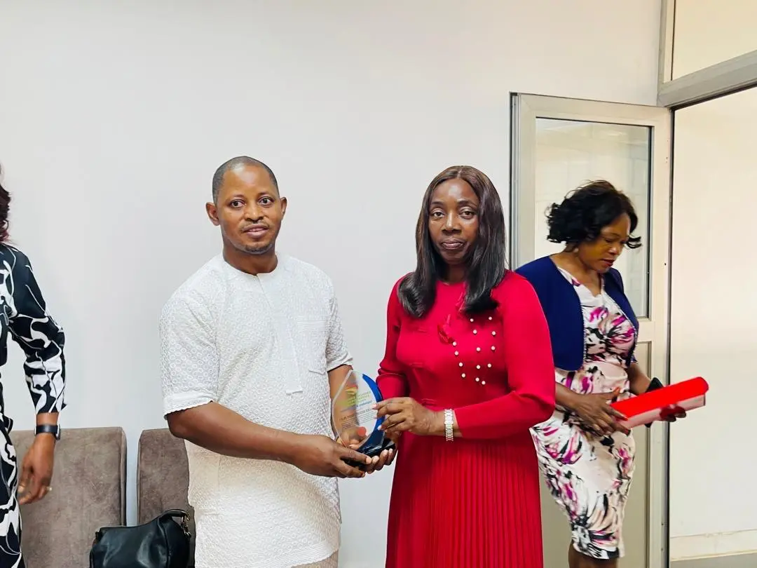 WEMAI representative receiving recognition
