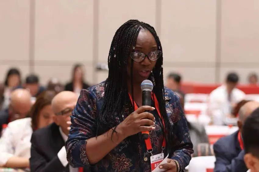 A woman speaking during an international forum
